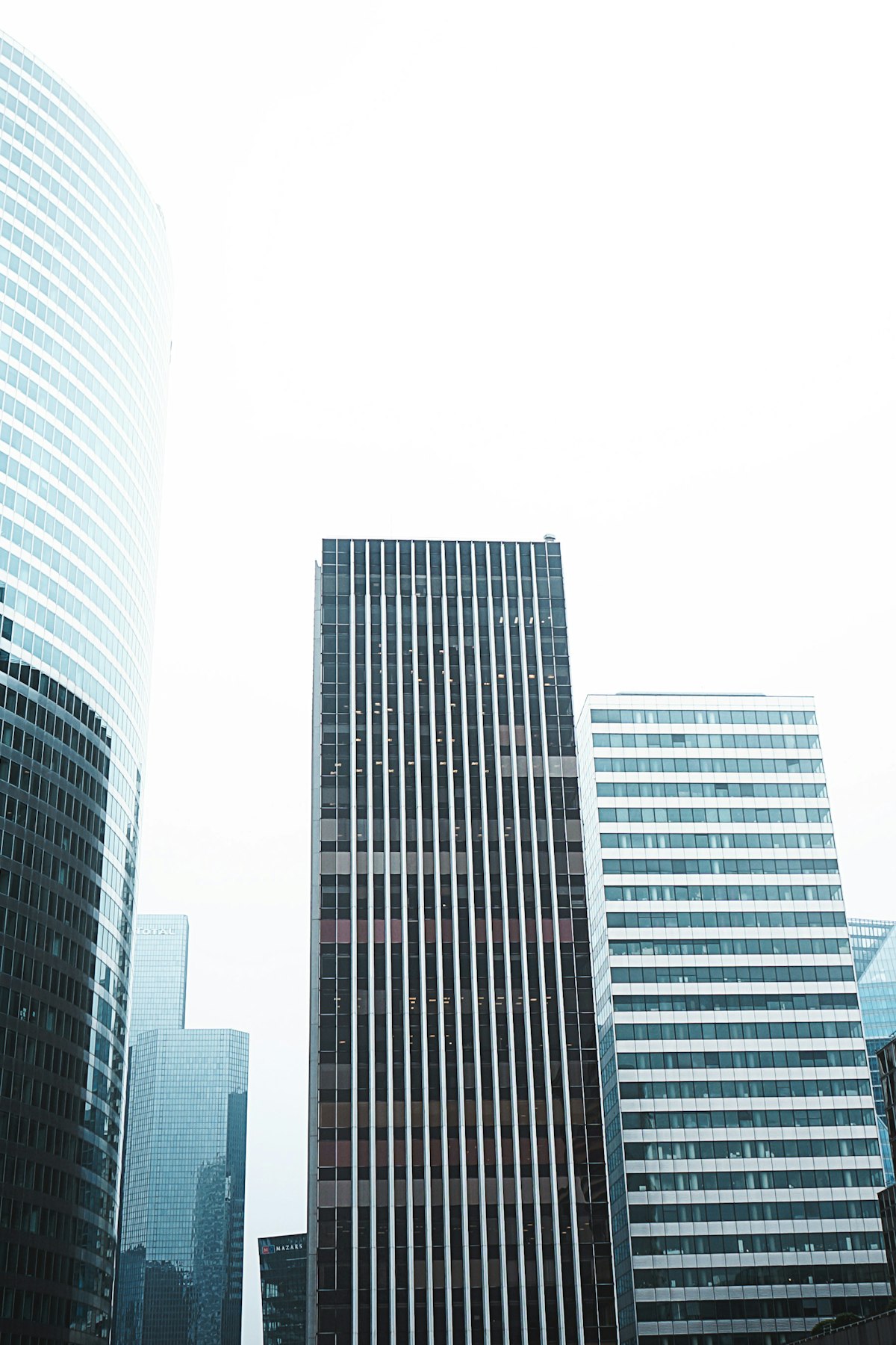 Modern corporate towers viewed from street level